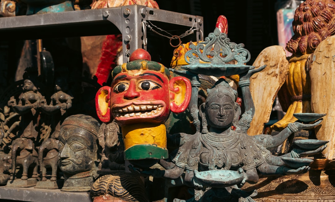 Collection of colorful tribal masks and statues